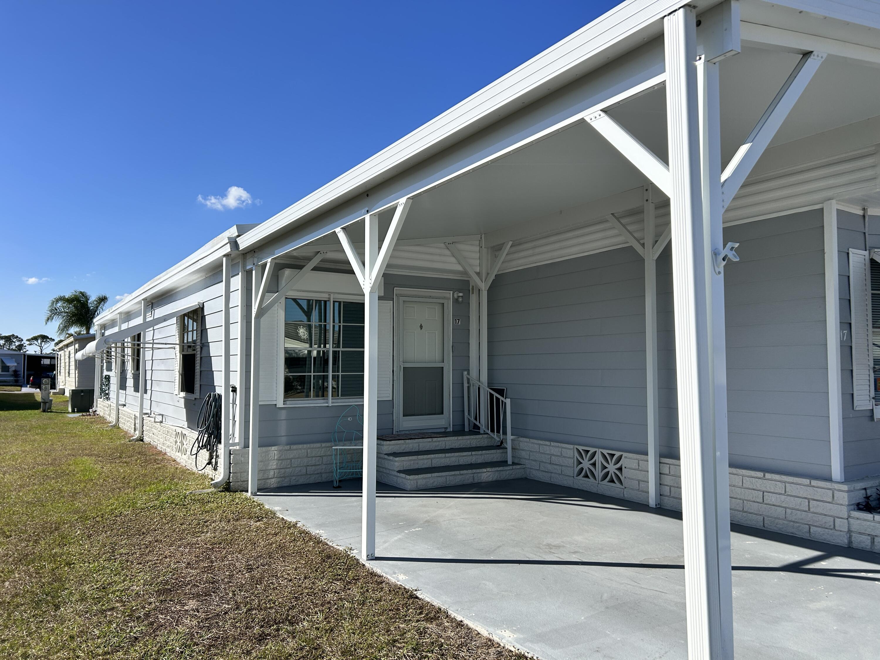 17 Verde Vista Fort Pierce, FL 34951 - Photo 3 of 35 a view of a house with a door and porch