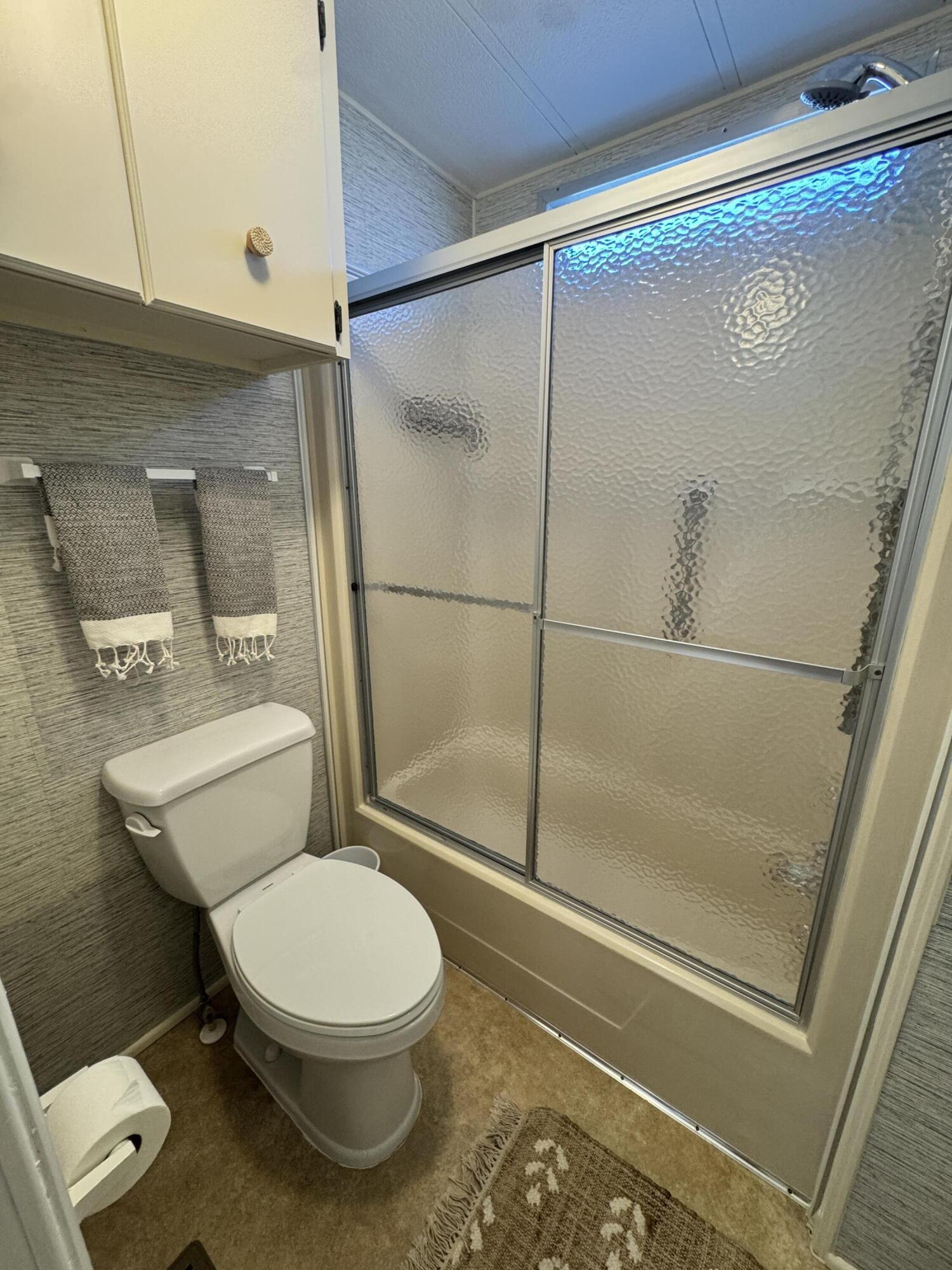 17 Verde Vista Fort Pierce, FL 34951 - Photo 31 of 35 a white toilet sitting next to a bath tub