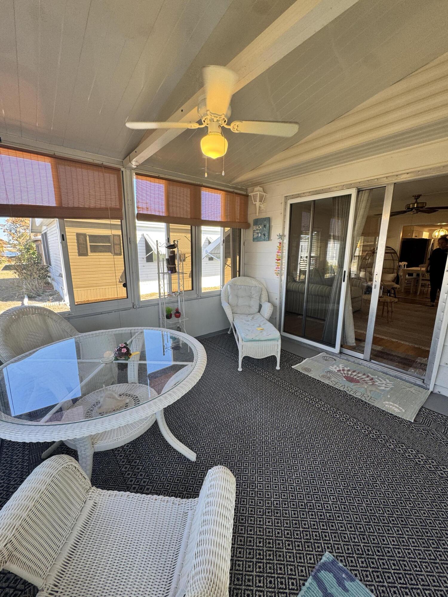 17 Verde Vista Fort Pierce, FL 34951 - Photo 33 of 35 a living room with furniture and a floor to ceiling window