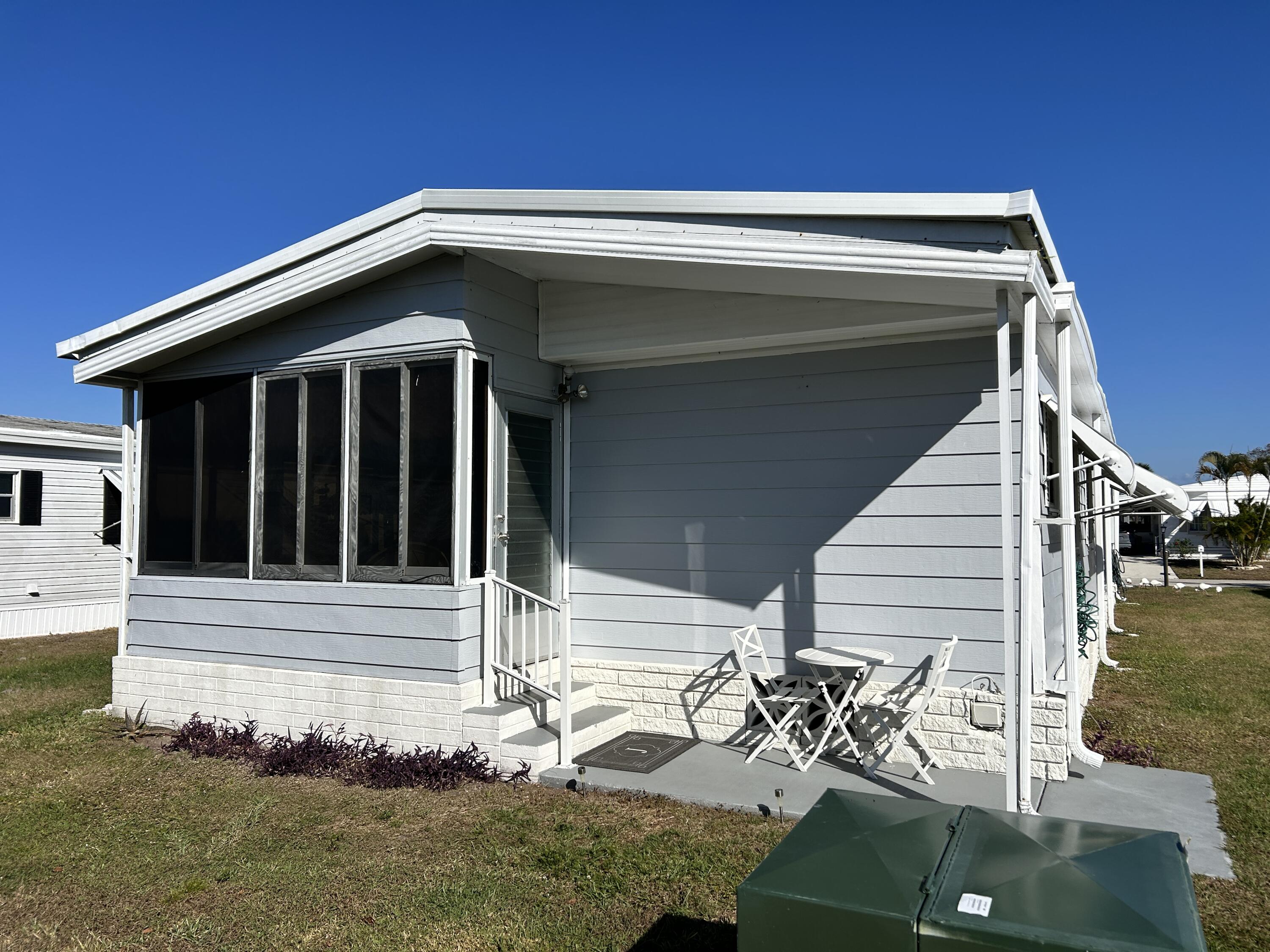 17 Verde Vista Fort Pierce, FL 34951 - Photo 9 of 35 a view of wooden house with a large window