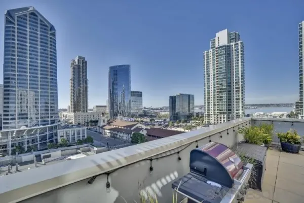 a kitchen with a sink and a large mirror