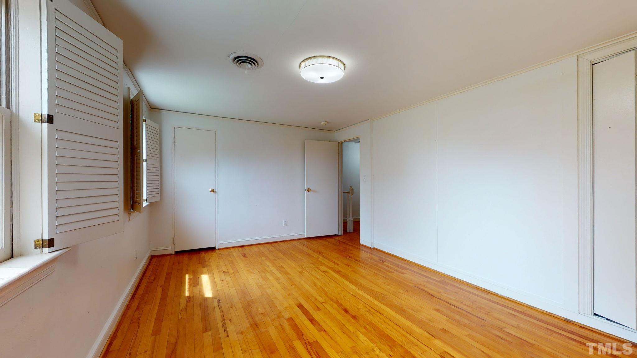 845 Bryan Street Raleigh, NC 27605 - Photo 21 of 31 a view of empty room with wooden floor