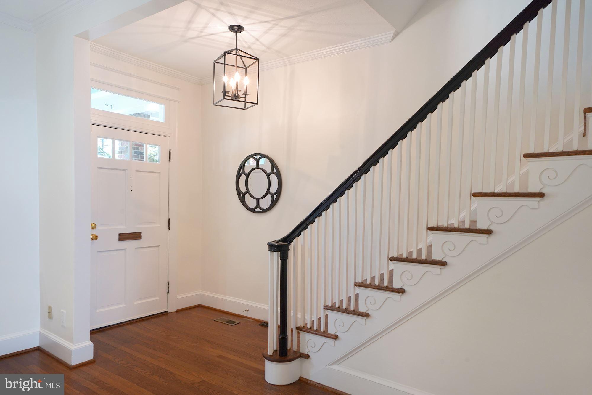 2409 Tunlaw Road Northwest Washington, DC 20007 - Photo 8 of 42 Wide entryway with beautiful staircase