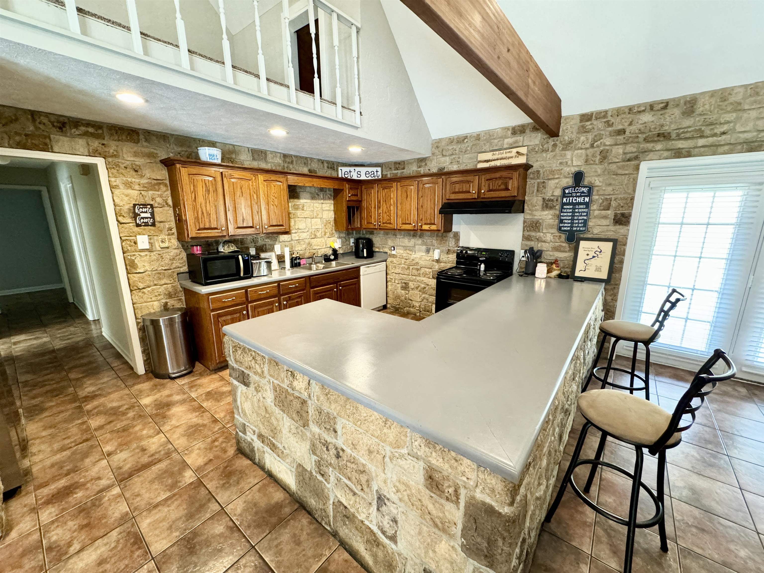 2455 Edith-Nankipoo Road Ripley, TN 38063 - Photo 12 of 29 a kitchen with stainless steel appliances granite countertop a sink a stove and a refrigerator