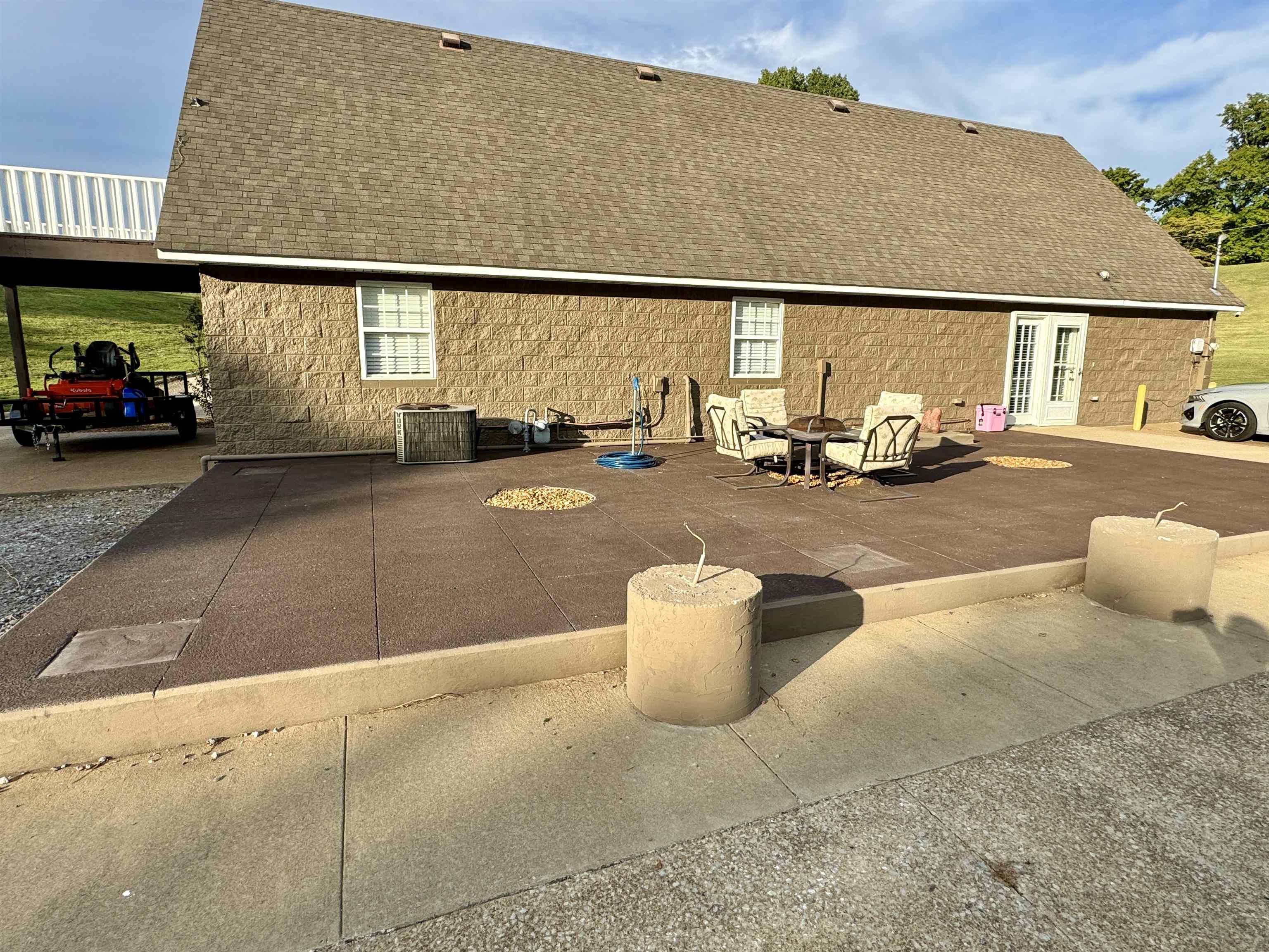 2455 Edith-Nankipoo Road Ripley, TN 38063 - Photo 23 of 29 a view of a patio with table and chairs with wooden floor
