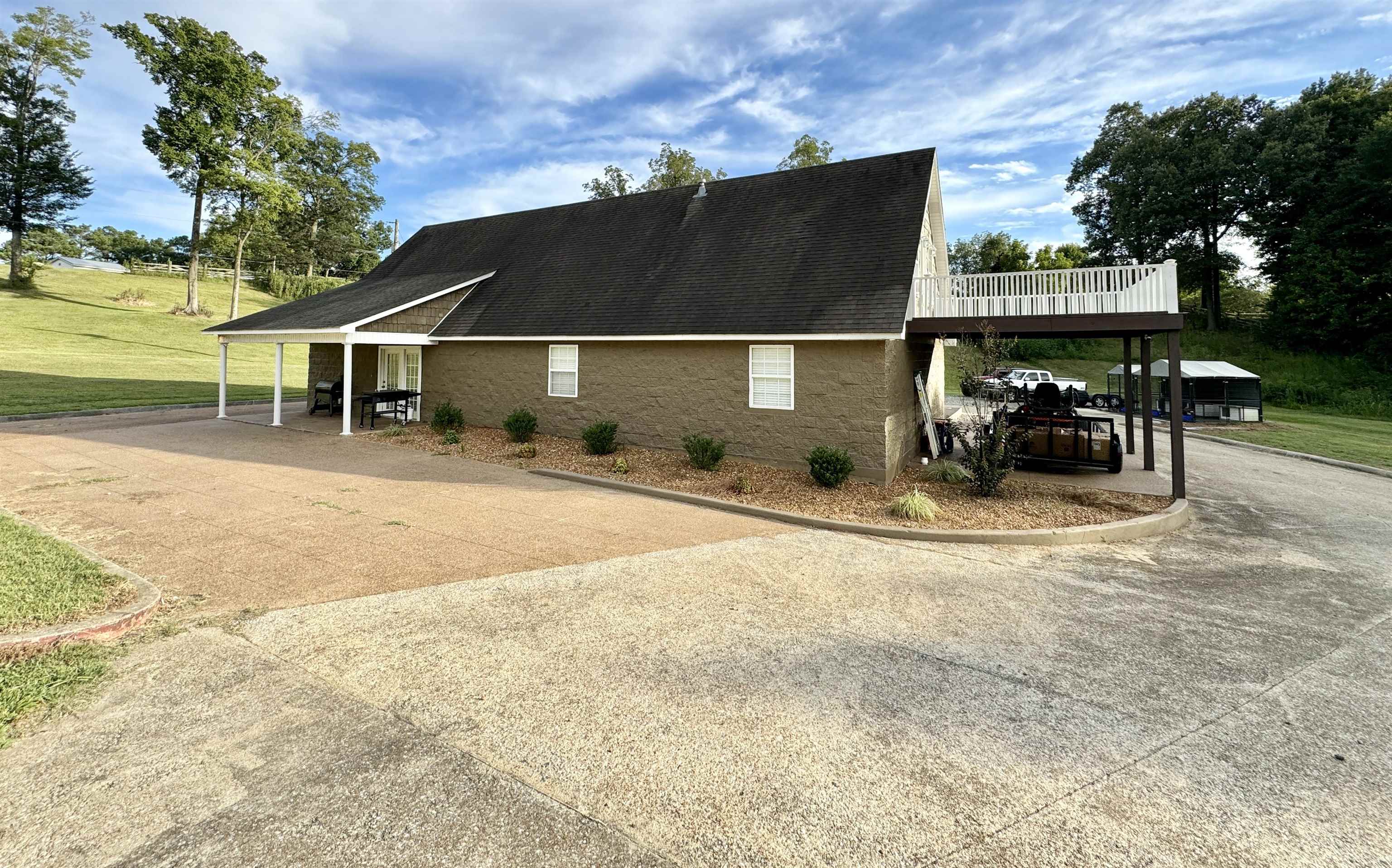 2455 Edith-Nankipoo Road Ripley, TN 38063 - Photo 27 of 29 a backyard of a house with table and chairs