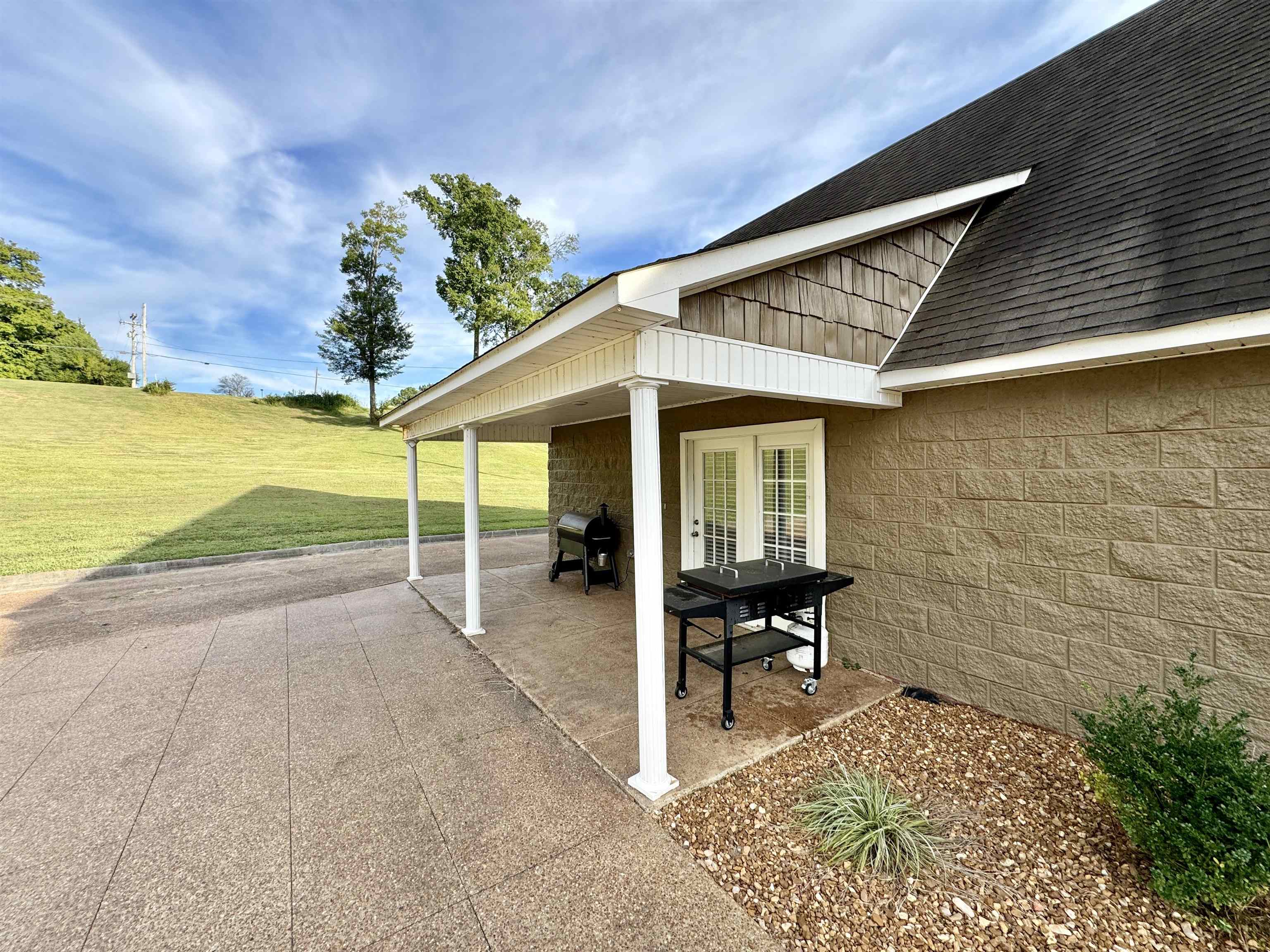 2455 Edith-Nankipoo Road Ripley, TN 38063 - Photo 9 of 29 a backyard of a house with table and chairs