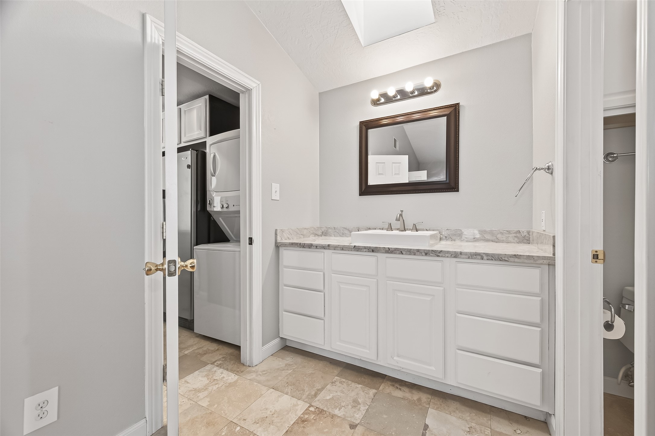 2211 South Kirkwood Road, Unit 42 Houston, TX 77077 - Photo 18 of 34 a bathroom with a granite countertop sink and a mirror
