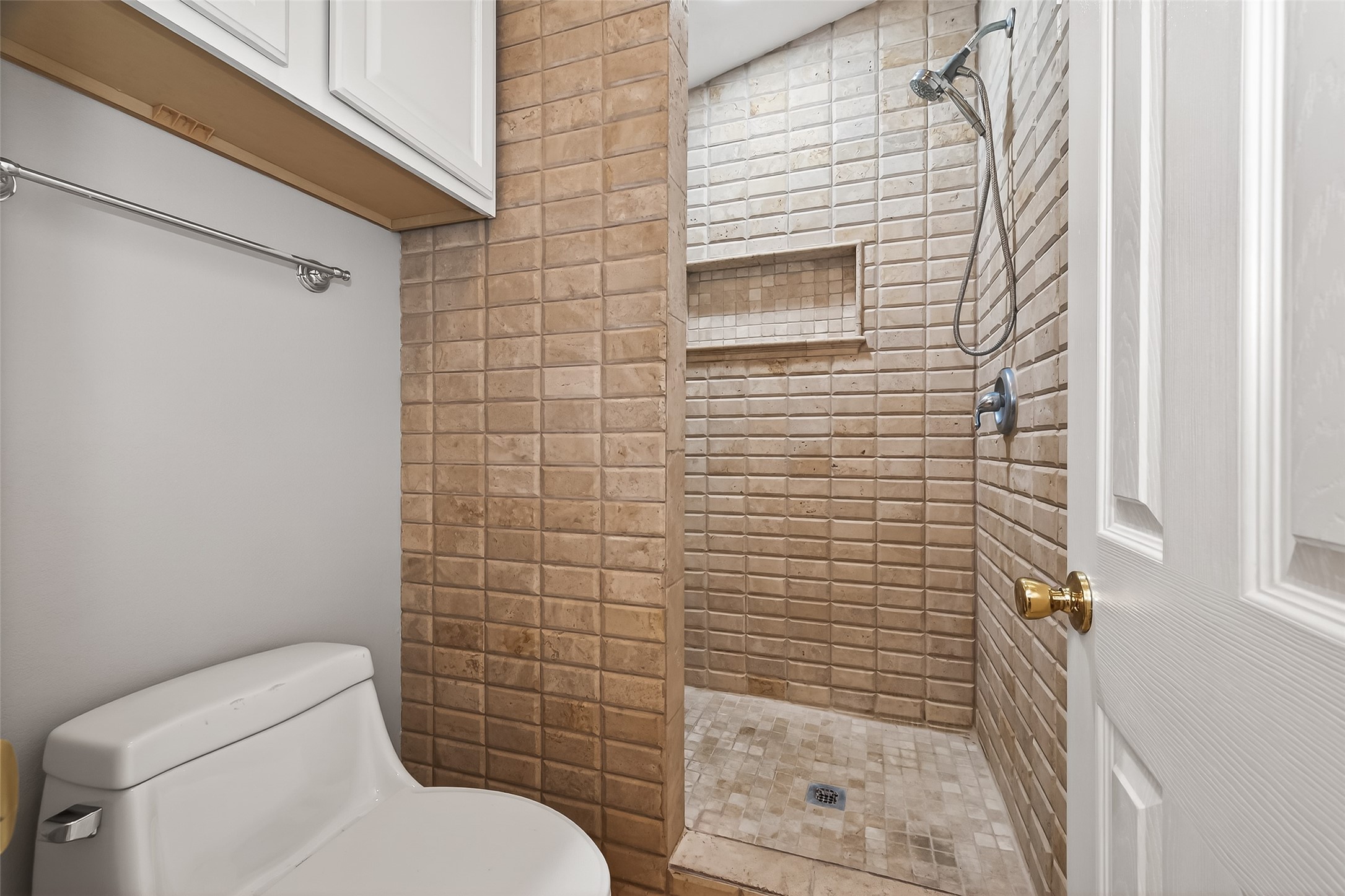 2211 South Kirkwood Road, Unit 42 Houston, TX 77077 - Photo 20 of 34 a bathroom with a toilet and shower