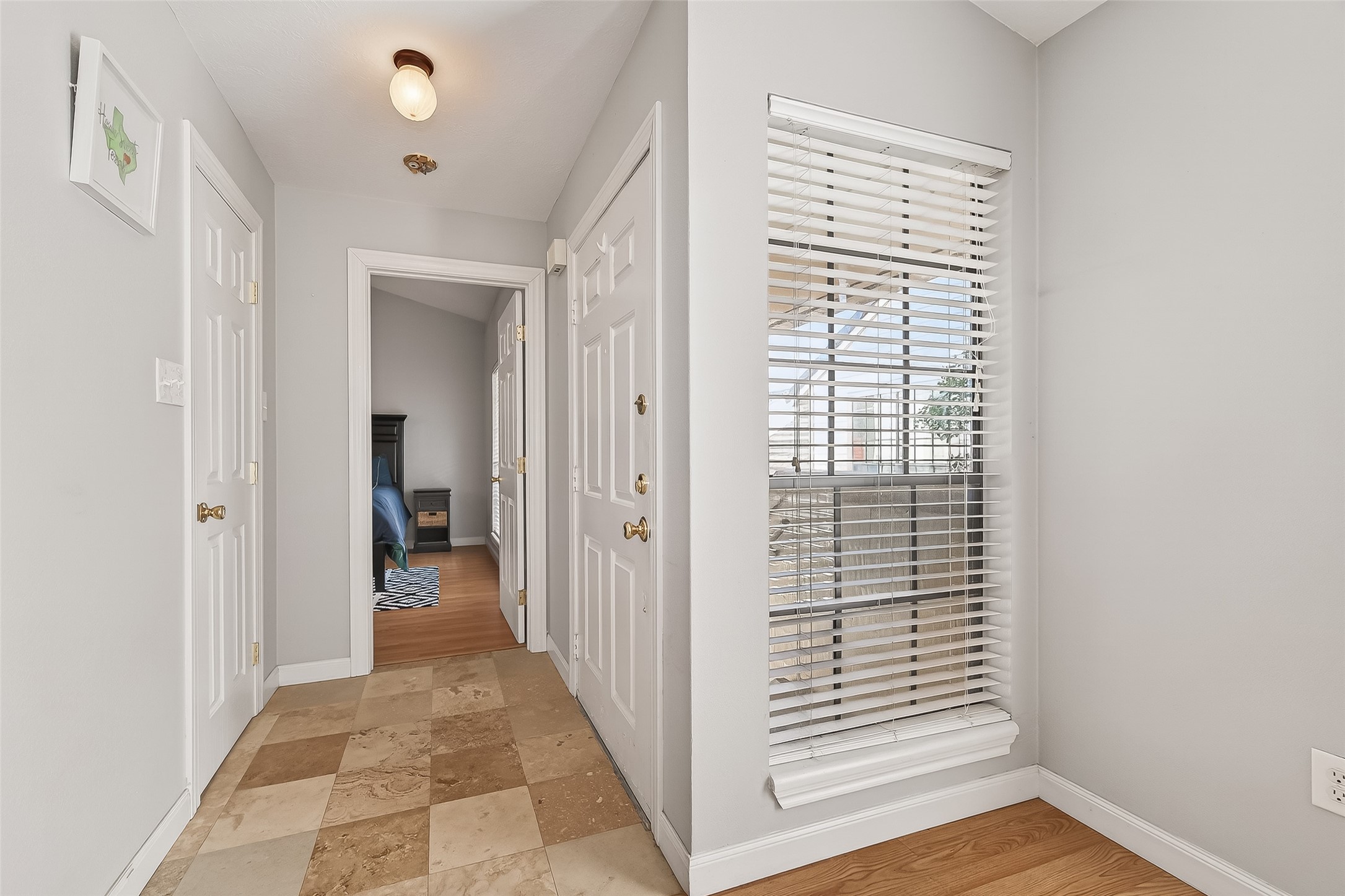 2211 South Kirkwood Road, Unit 42 Houston, TX 77077 - Photo 28 of 34 a view of a hallway with wooden floor and closet