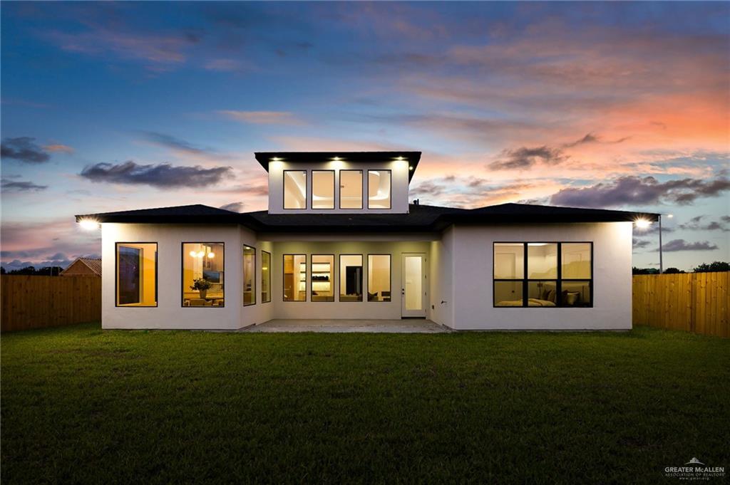 1107 Benjamin Street Mission, TX 78573 - Photo 4 of 19 Modern stucco exterior with a multi-level roofline