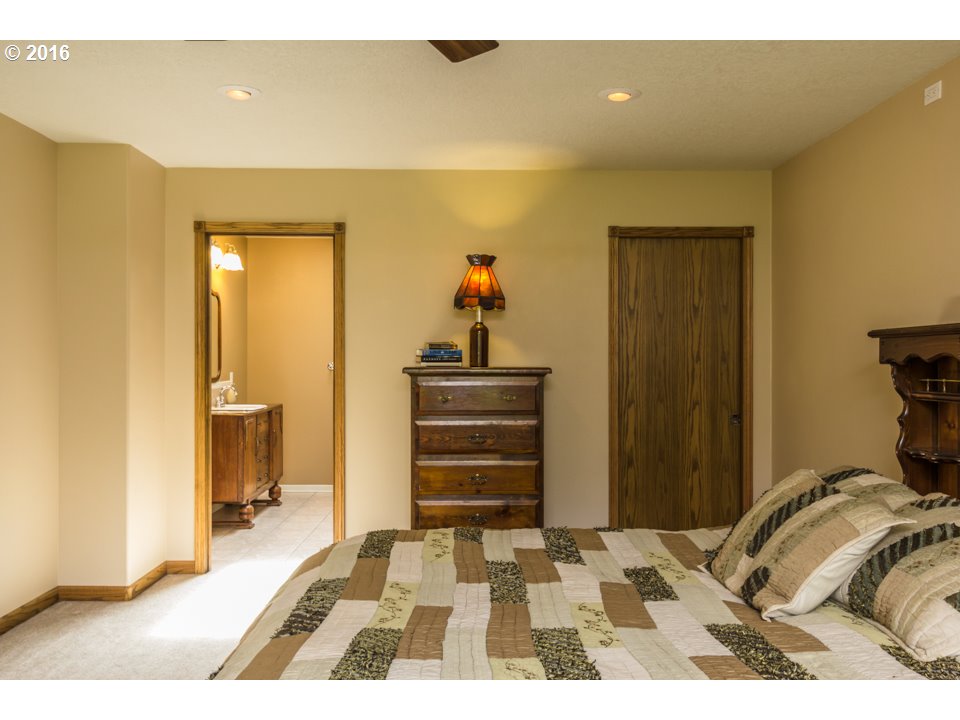 2686 Southeast Territorial Road Canby, OR 97013 - Photo 18 of 32 a bedroom with a bed and a view of bathroom