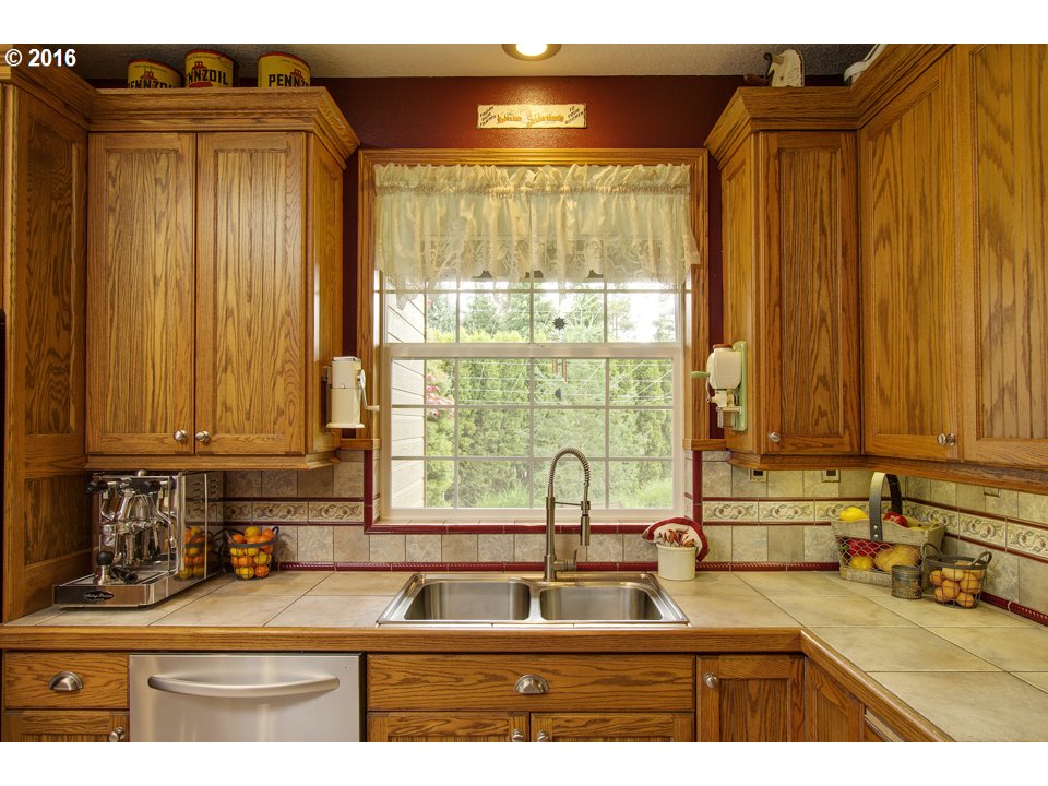 2686 Southeast Territorial Road Canby, OR 97013 - Photo 8 of 32 a kitchen with stainless steel appliances granite countertop a sink and a cabinets