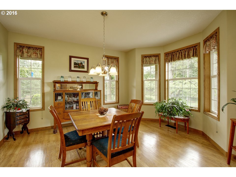 2686 Southeast Territorial Road Canby, OR 97013 - Photo 10 of 32 a view of a dining room with furniture window and wooden floor