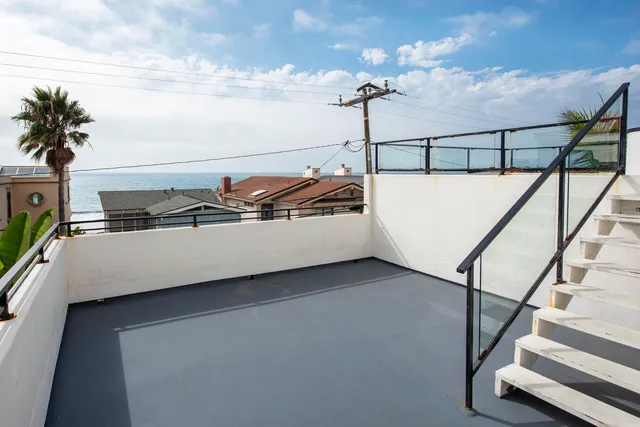 a view of a hallway with staircase