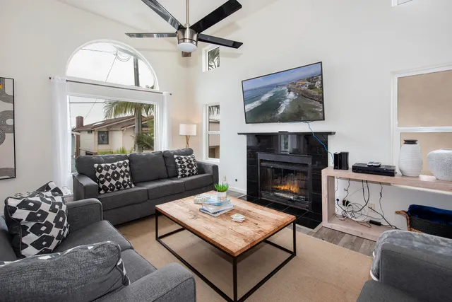 a living room with furniture and a fireplace