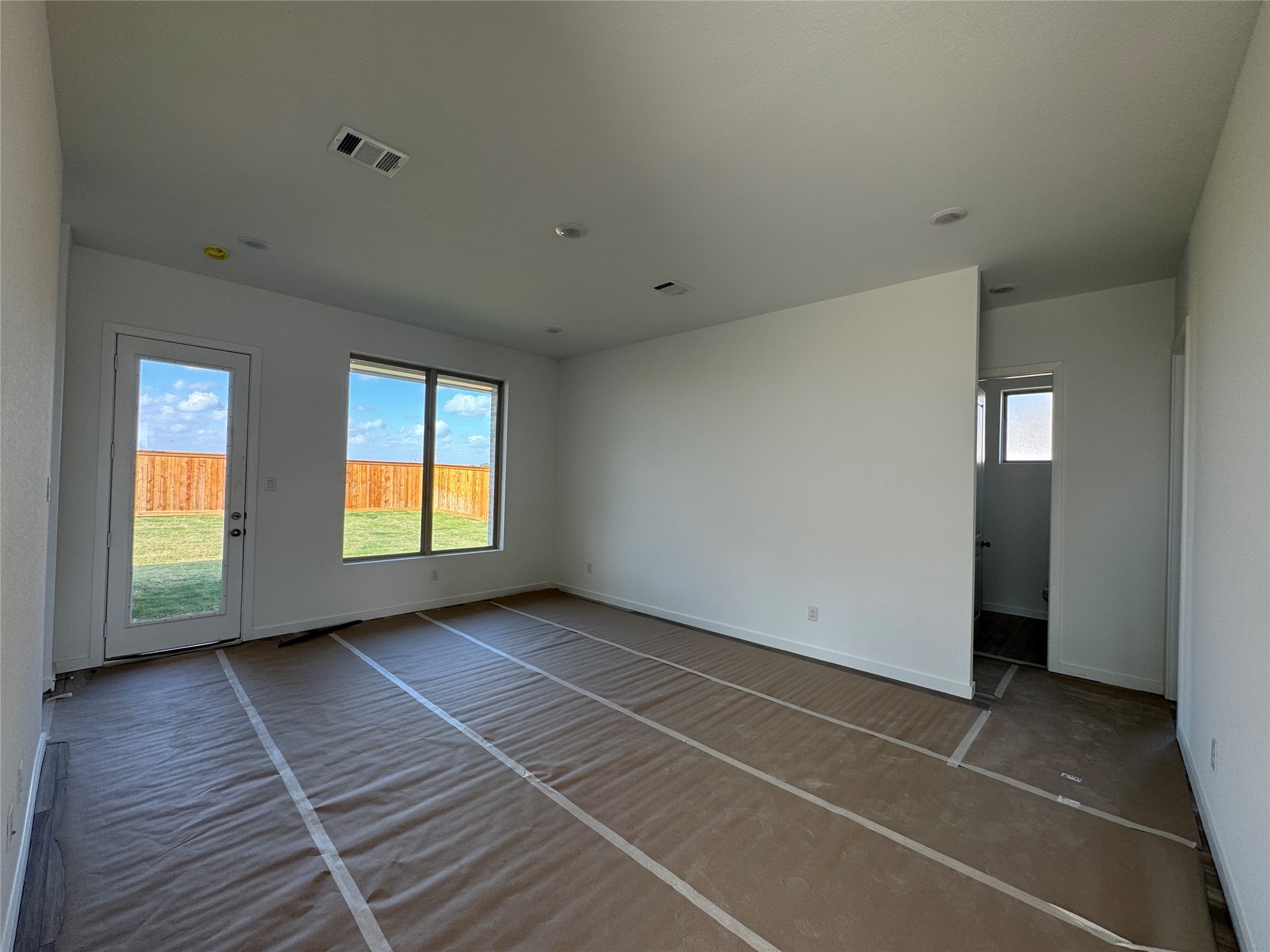 4326 Eagle Pass Drive Rosharon, TX 77583 - Photo 5 of 9 a view of an empty room with window and wooden floor