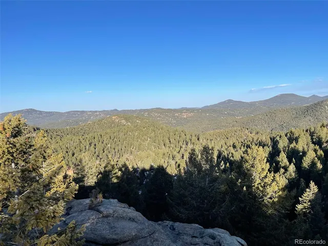 a view of mountain view with mountains in the background