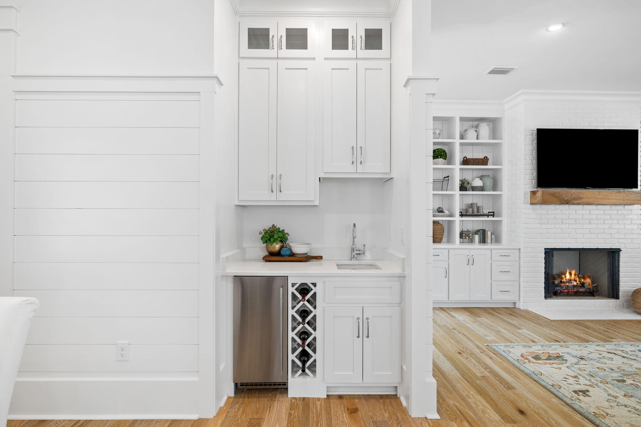 201 Needle Cast Ln Inlet Beach Inlet Beach, FL 32461 - Photo 34 of 92 a kitchen with granite countertop a fireplace a flat screen tv and a window