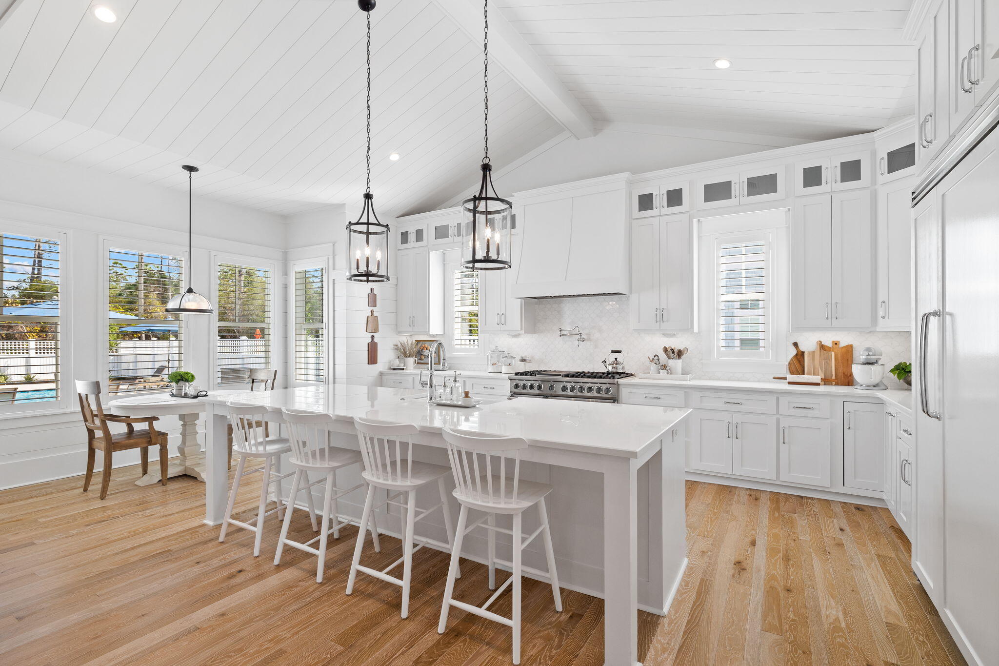 201 Needle Cast Ln Inlet Beach Inlet Beach, FL 32461 - Photo 35 of 92 a kitchen with stainless steel appliances granite countertop a stove a sink dishwasher and a refrigerator with wooden floor
