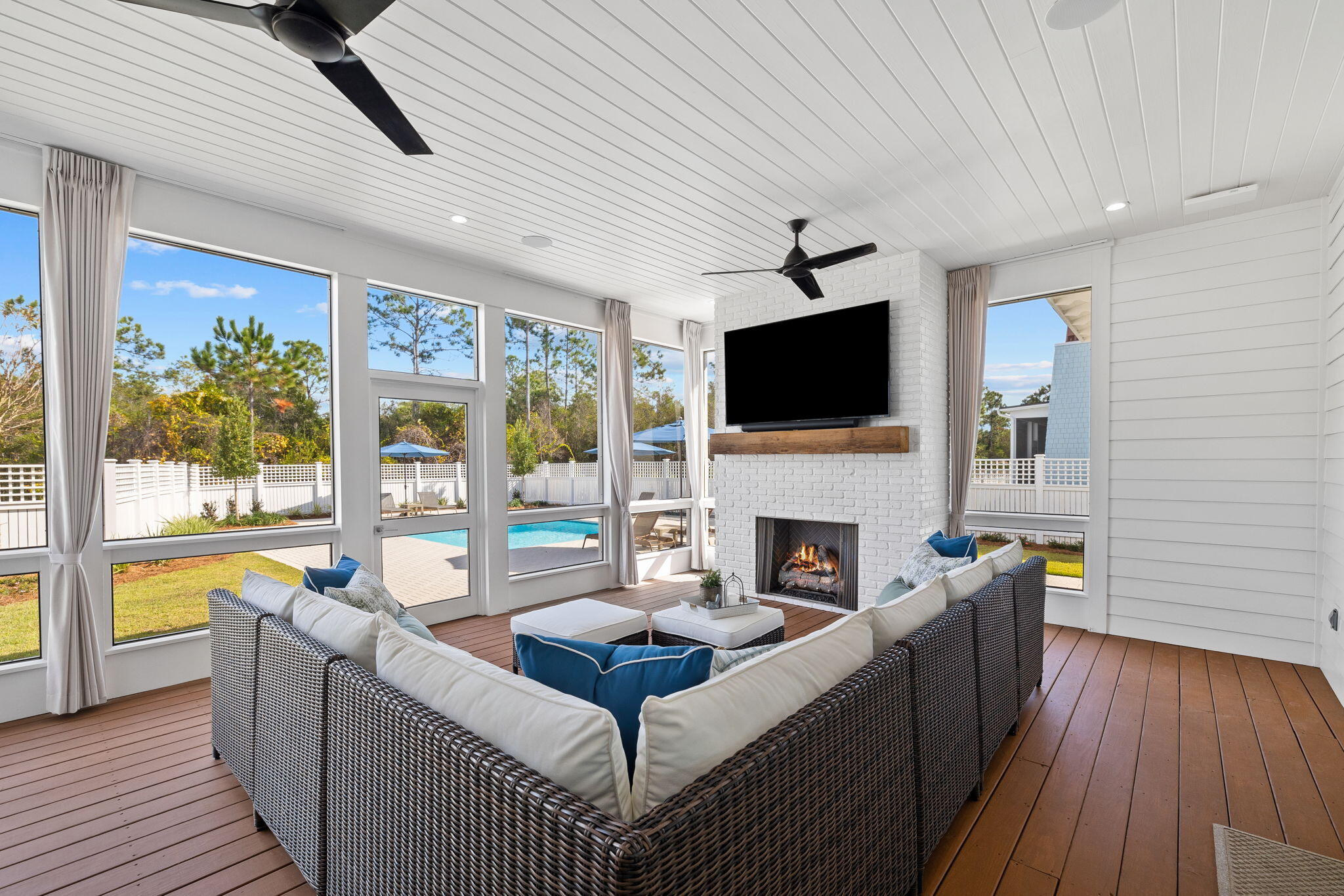 201 Needle Cast Ln Inlet Beach Inlet Beach, FL 32461 - Photo 43 of 92 a living room with furniture a fireplace and a flat screen tv