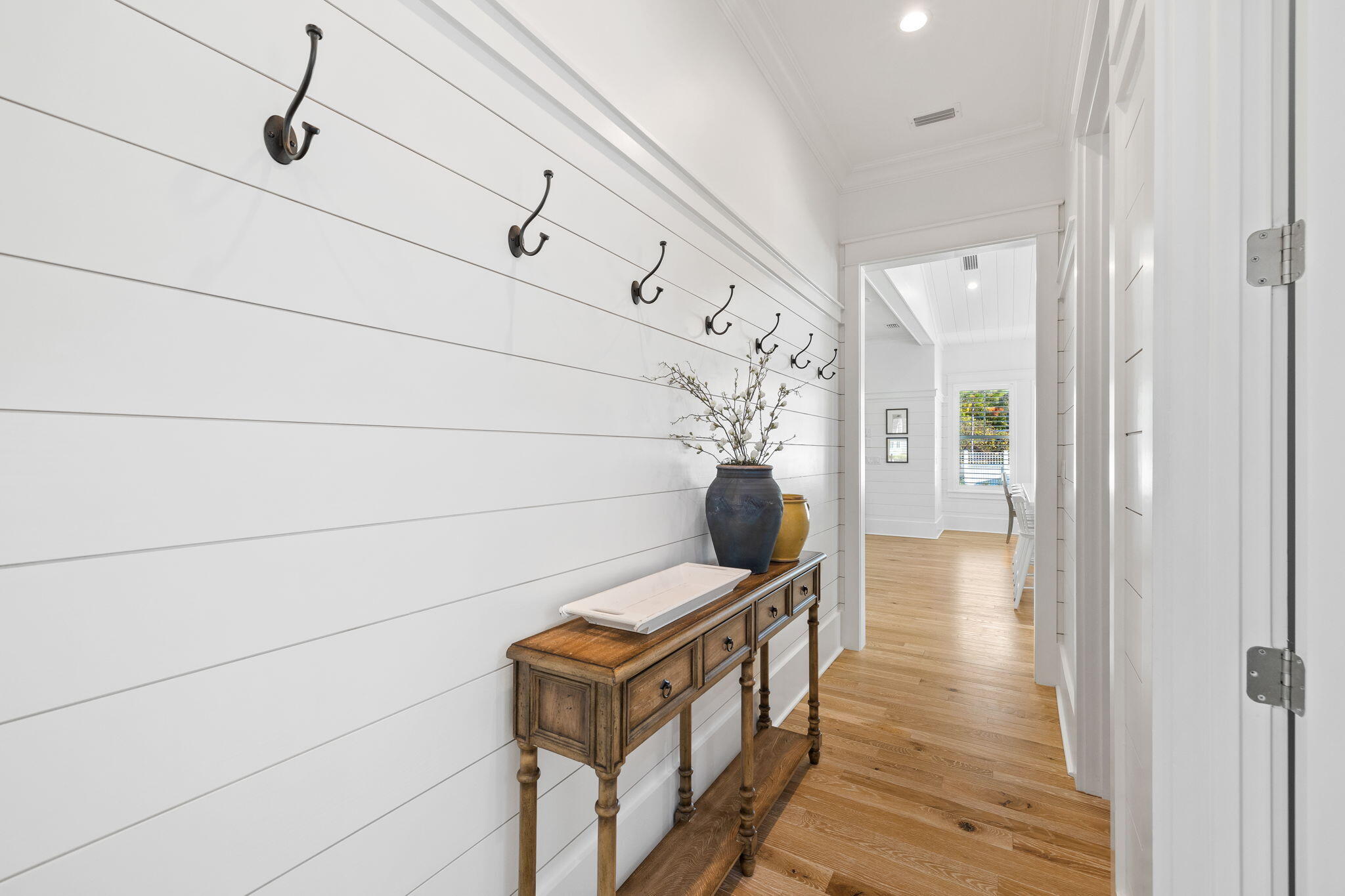 201 Needle Cast Ln Inlet Beach Inlet Beach, FL 32461 - Photo 45 of 92 a view of a hallway with wooden floor and staircase