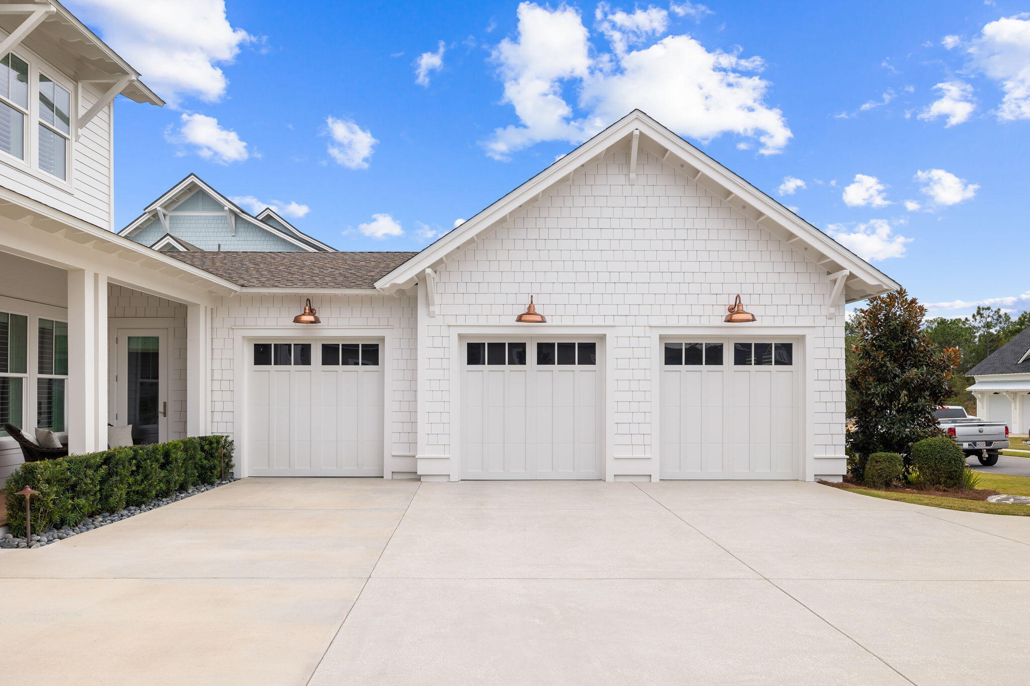 201 Needle Cast Ln Inlet Beach Inlet Beach, FL 32461 - Photo 75 of 92 a view of a white house with a yard and potted plants