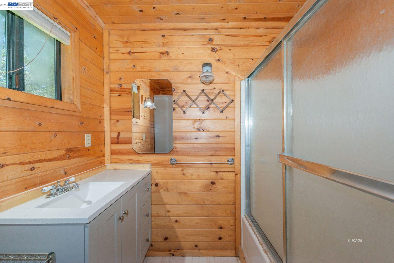 11221 Corral Bottom Road Big Bar, CA 96010 - Photo 15 of 50 a bathroom with a sink and a shower