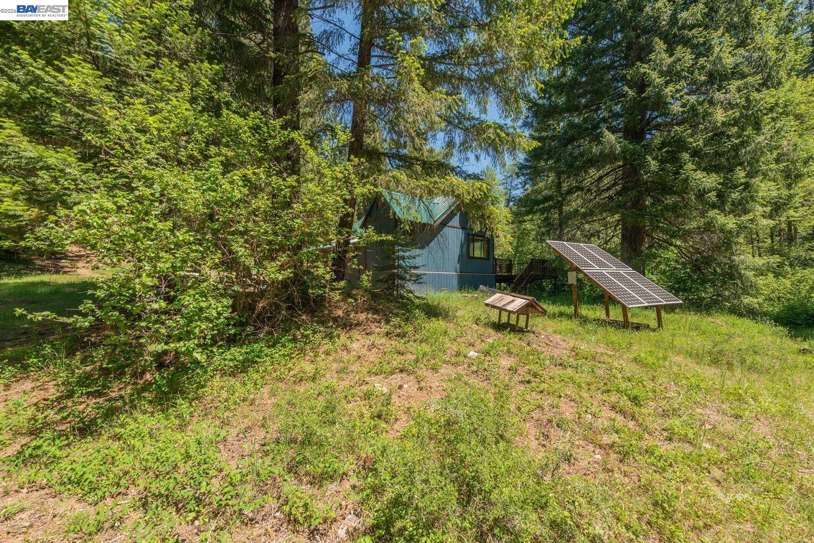 11221 Corral Bottom Road Big Bar, CA 96010 - Photo 28 of 50 a view of a house with a yard