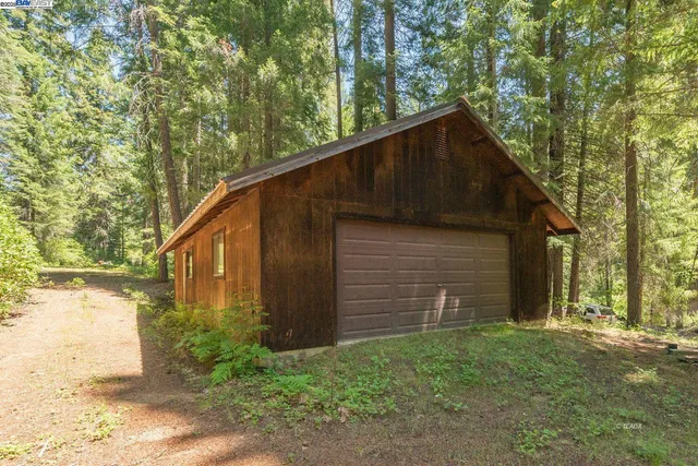 a view of a wooden deck with a yard