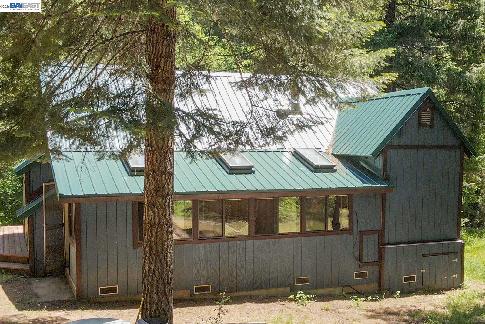 11221 Corral Bottom Road Big Bar, CA 96010 - Photo 33 of 50 a view of a house with a yard