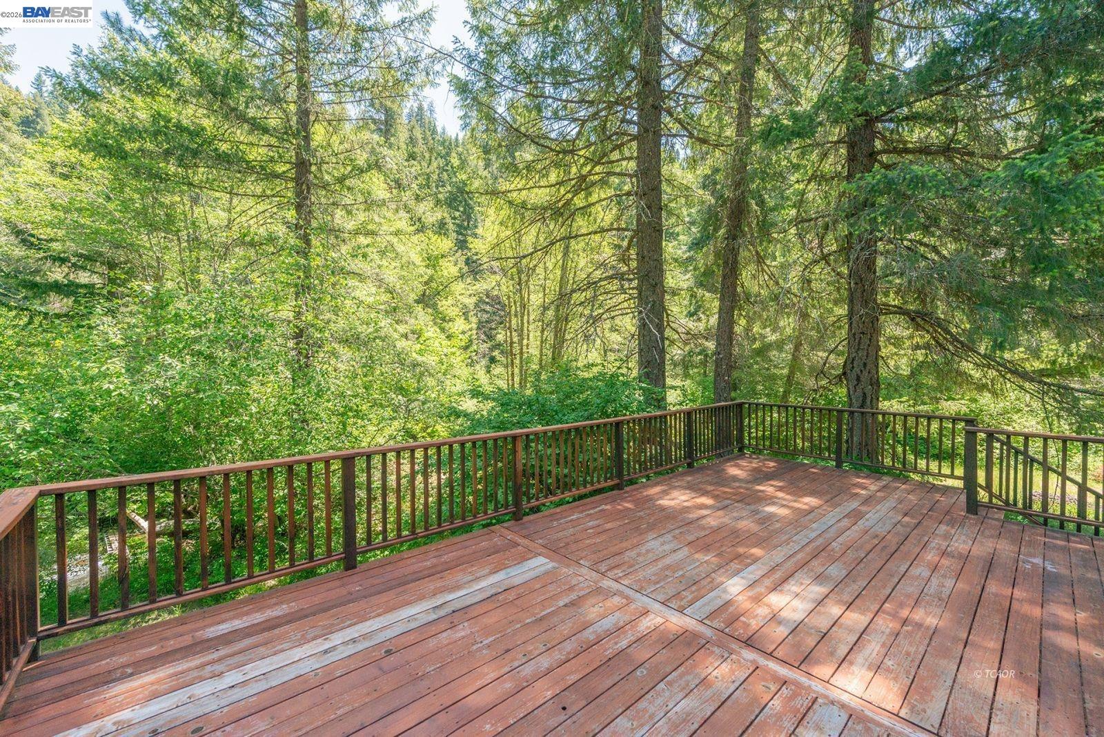 11221 Corral Bottom Road Big Bar, CA 96010 - Photo 40 of 50 a view of a balcony with wooden floor