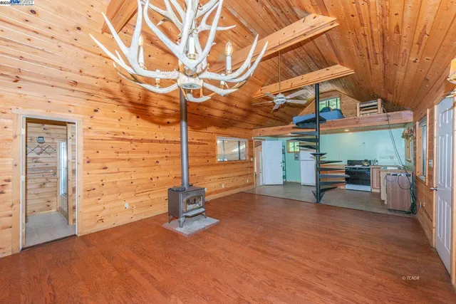 a view of a room with wooden walls