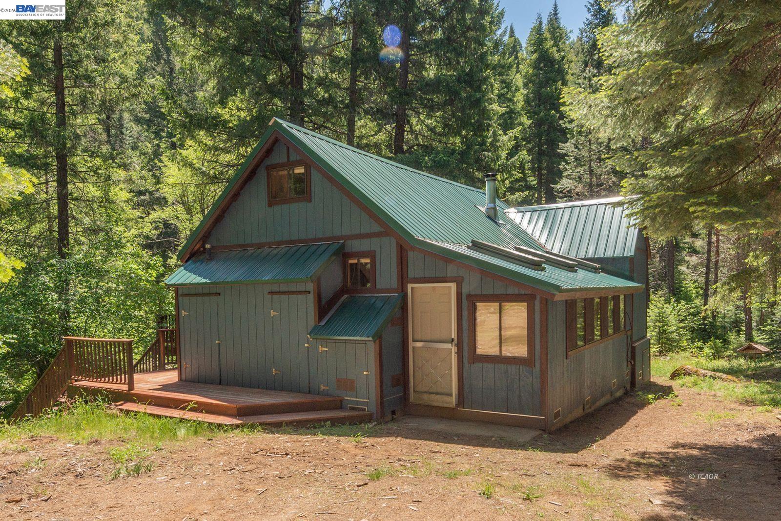 11221 Corral Bottom Road Big Bar, CA 96010 - Photo 47 of 50 a front view of a house with garden