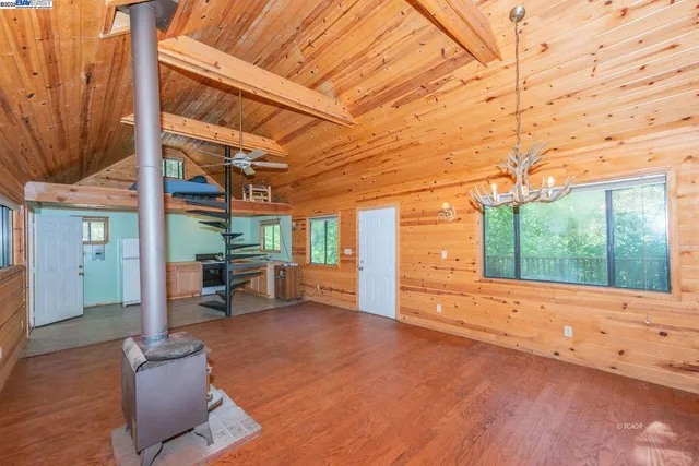 a view of a patio with table and chairs with wooden floor