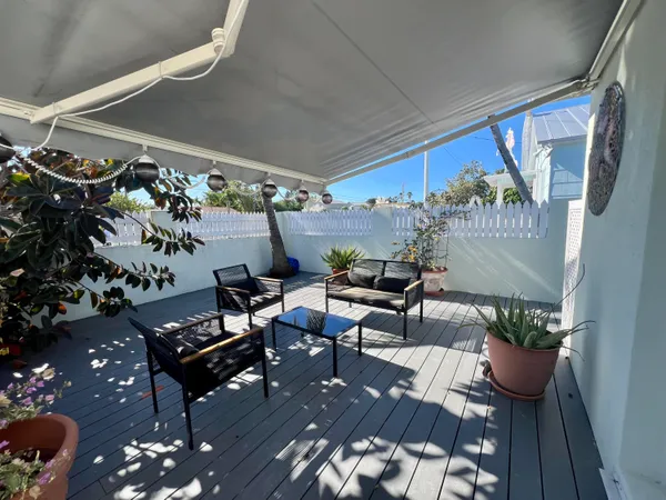 a outdoor living space with furniture and a potted plant