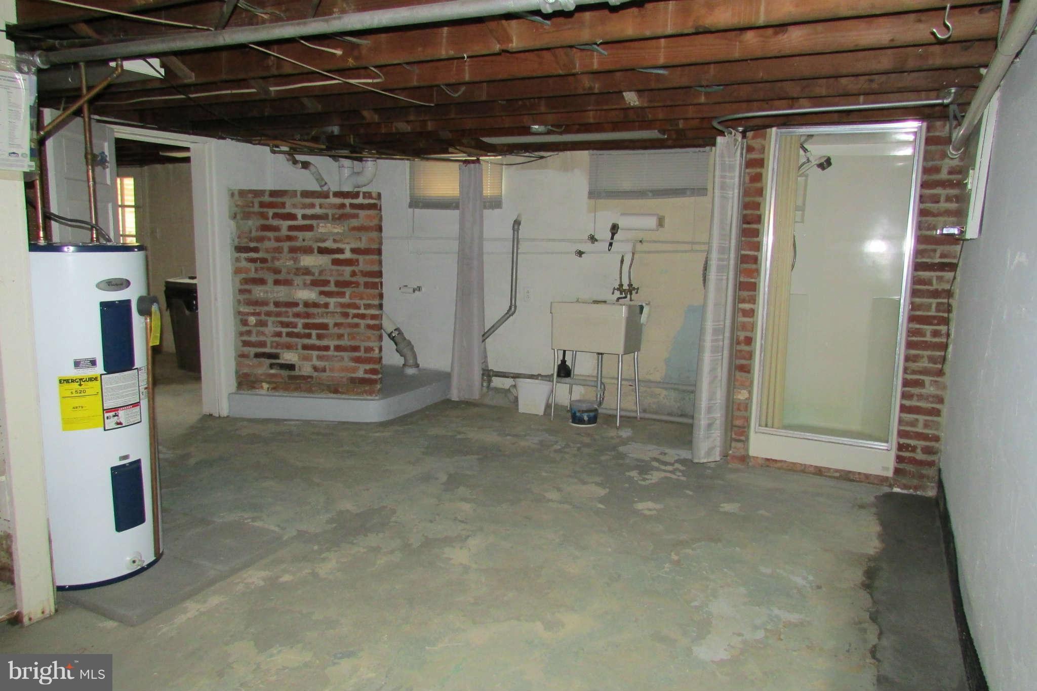 9217 Baltimore Road Frederick, MD 21704 - Photo 21 of 26 shower and commode in utility room