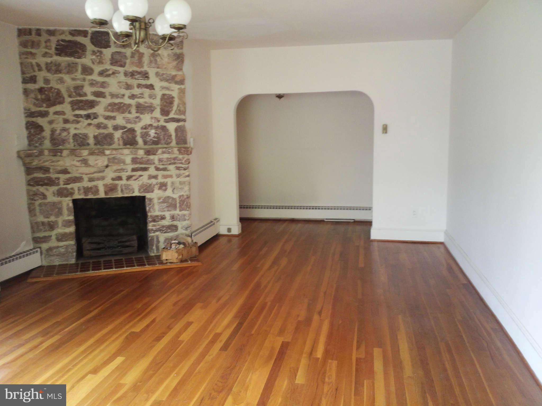 9217 Baltimore Road Frederick, MD 21704 - Photo 10 of 26 One of two stone FP s Wood floors
