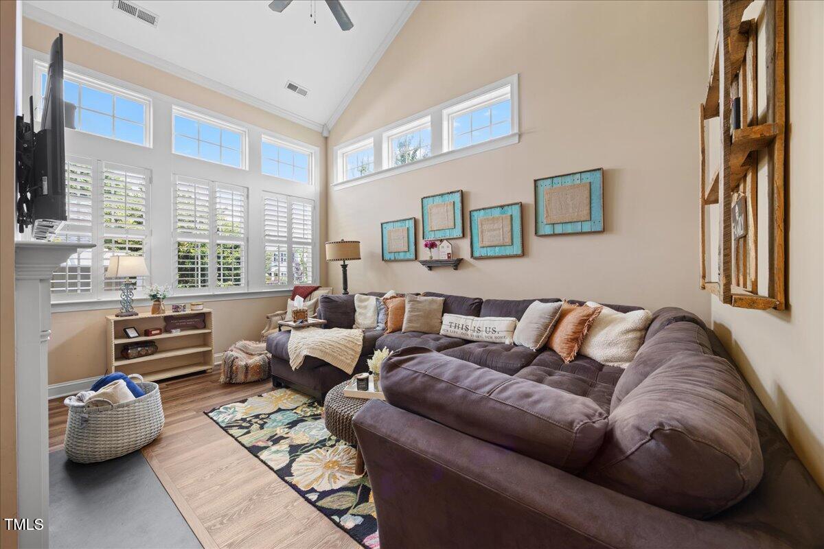 1300 Formal Garden Way Raleigh, NC 27603 - Photo 14 of 45 a living room with furniture and a large window