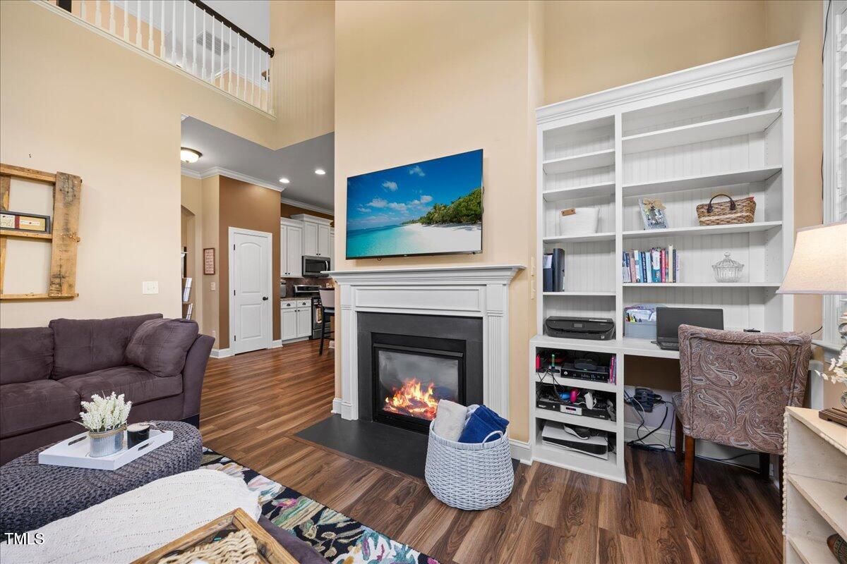 1300 Formal Garden Way Raleigh, NC 27603 - Photo 15 of 45 a living room with furniture and a fireplace