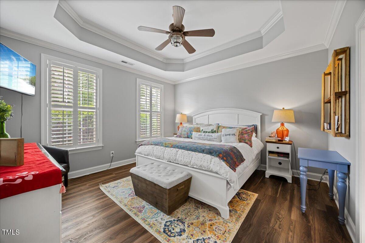 1300 Formal Garden Way Raleigh, NC 27603 - Photo 18 of 45 a bedroom with a bed and wooden floor