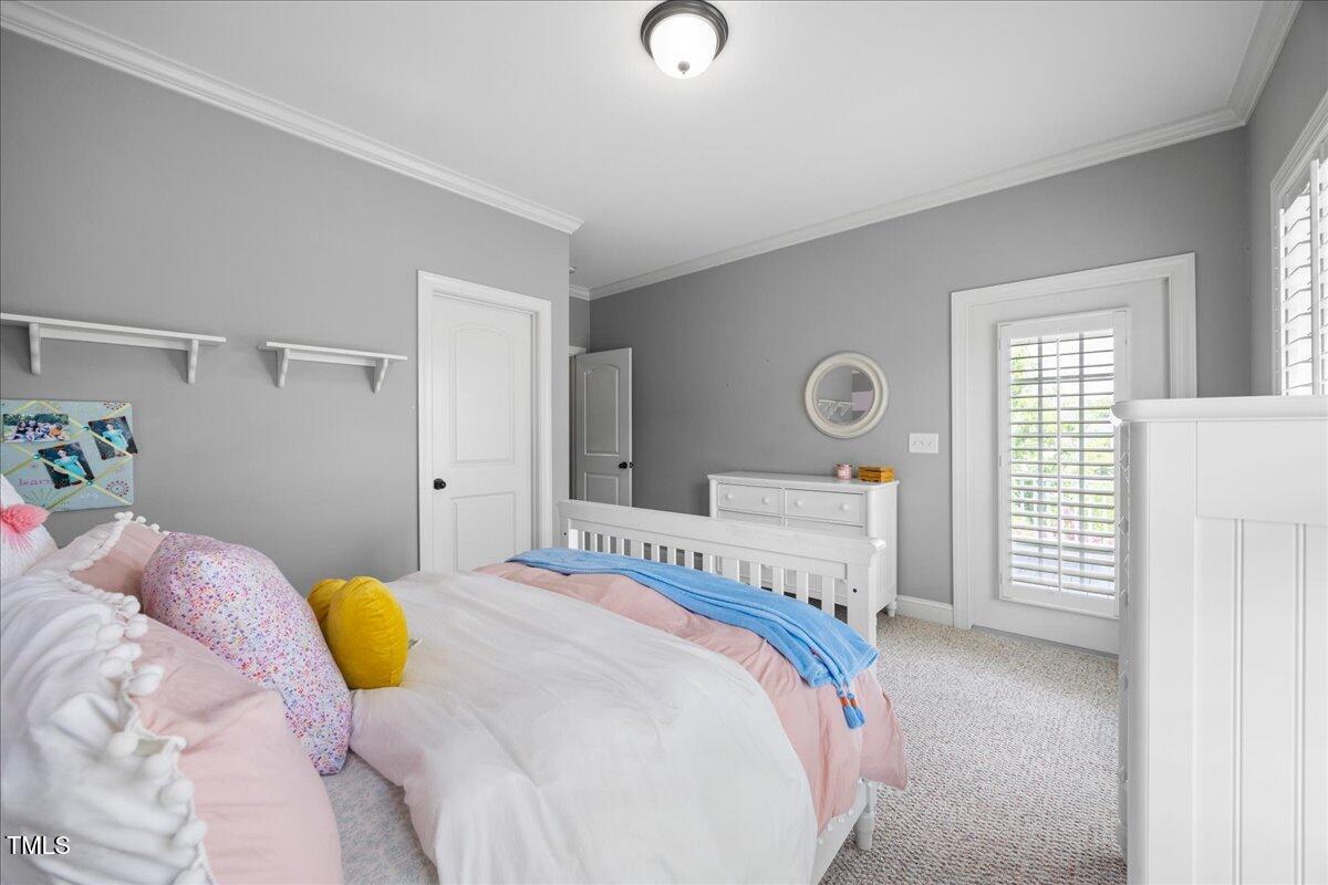 1300 Formal Garden Way Raleigh, NC 27603 - Photo 29 of 45 a bedroom with a bed and a window
