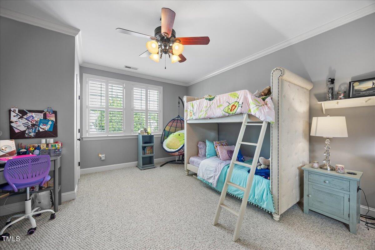 1300 Formal Garden Way Raleigh, NC 27603 - Photo 30 of 45 a bed room with a bed and a chandelier