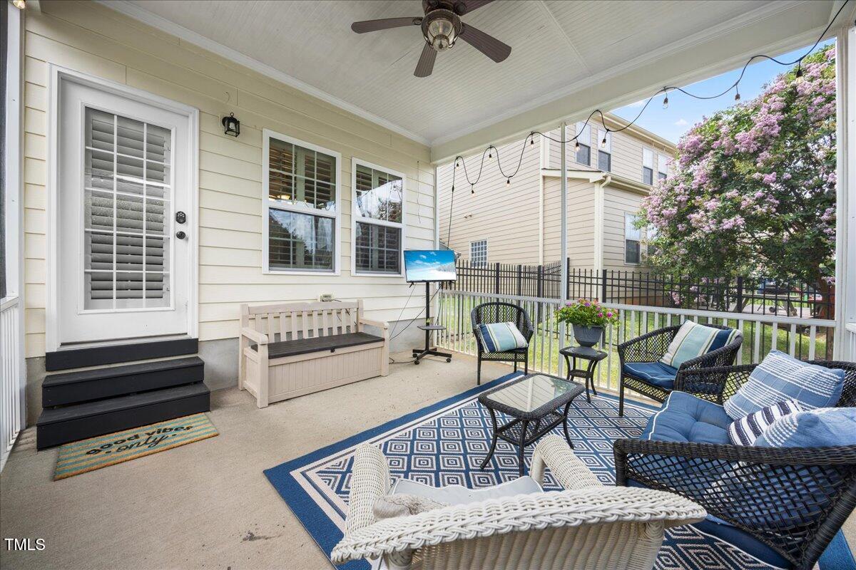1300 Formal Garden Way Raleigh, NC 27603 - Photo 33 of 45 a balcony with furniture and a potted plant