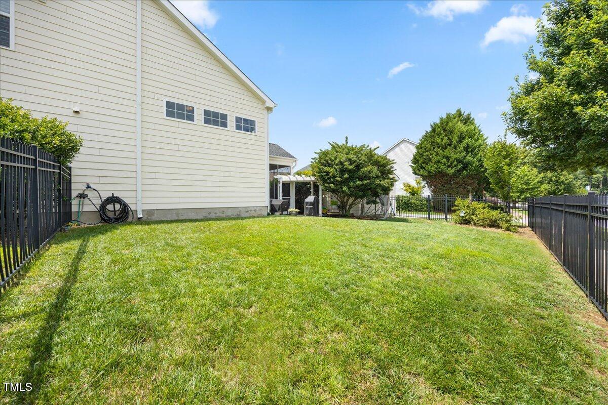 1300 Formal Garden Way Raleigh, NC 27603 - Photo 34 of 45 a view of a backyard with a garden