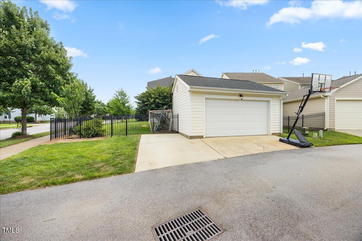 1300 Formal Garden Way Raleigh, NC 27603 - Photo 36 of 45 a view of a house with a yard and garage