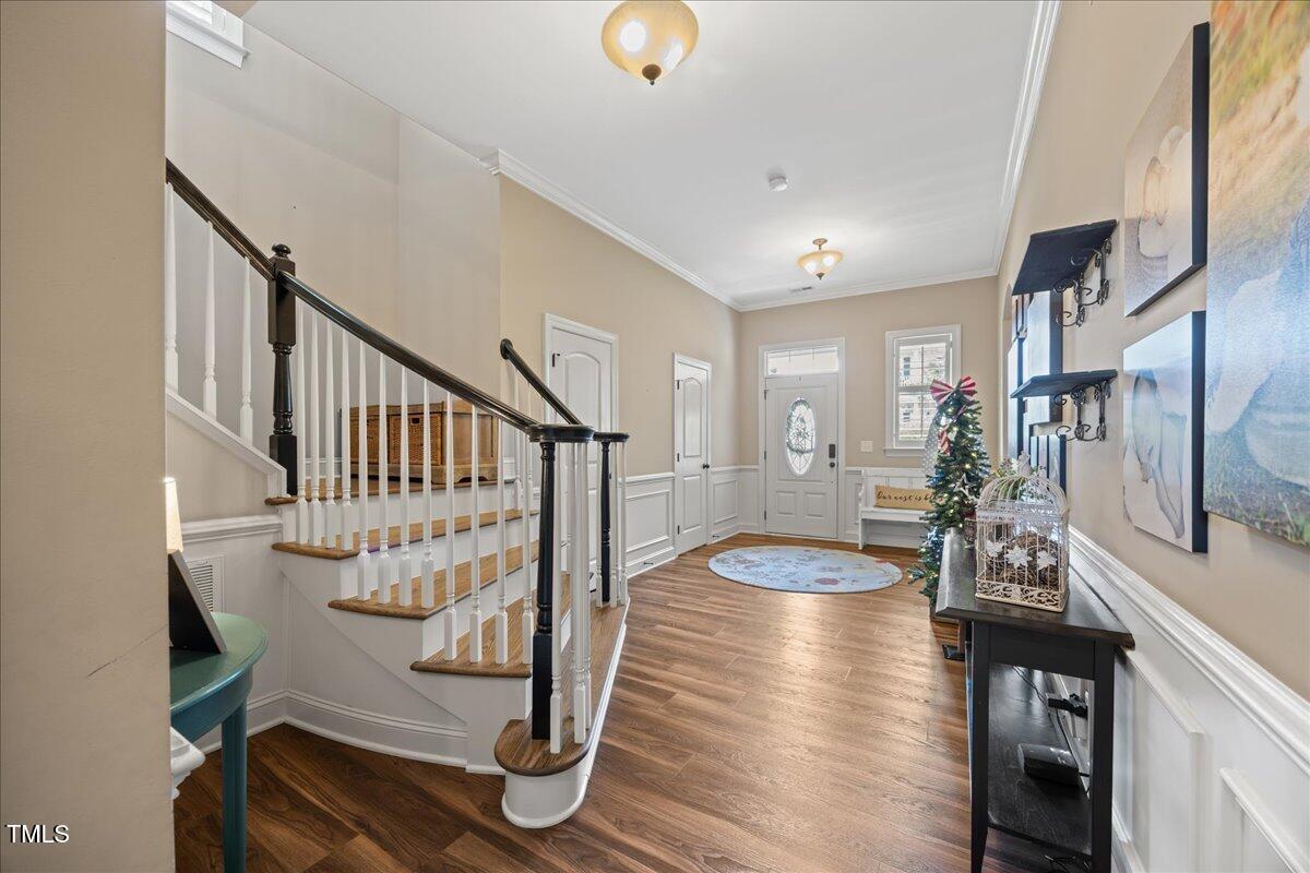 1300 Formal Garden Way Raleigh, NC 27603 - Photo 5 of 45 a view of entryway with wooden floor and stairs