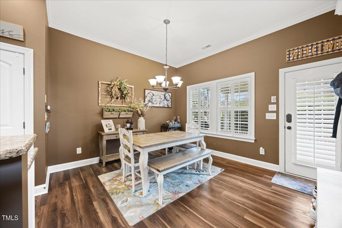 1300 Formal Garden Way Raleigh, NC 27603 - Photo 10 of 45 a living room with furniture a flat screen tv and a table