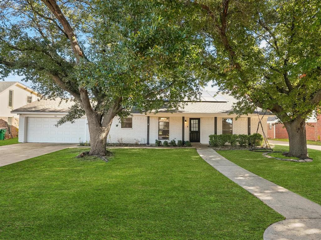 516 South Alabama Street Celina, TX 75009 - Photo 1 of 31 a front view of a house with a garden