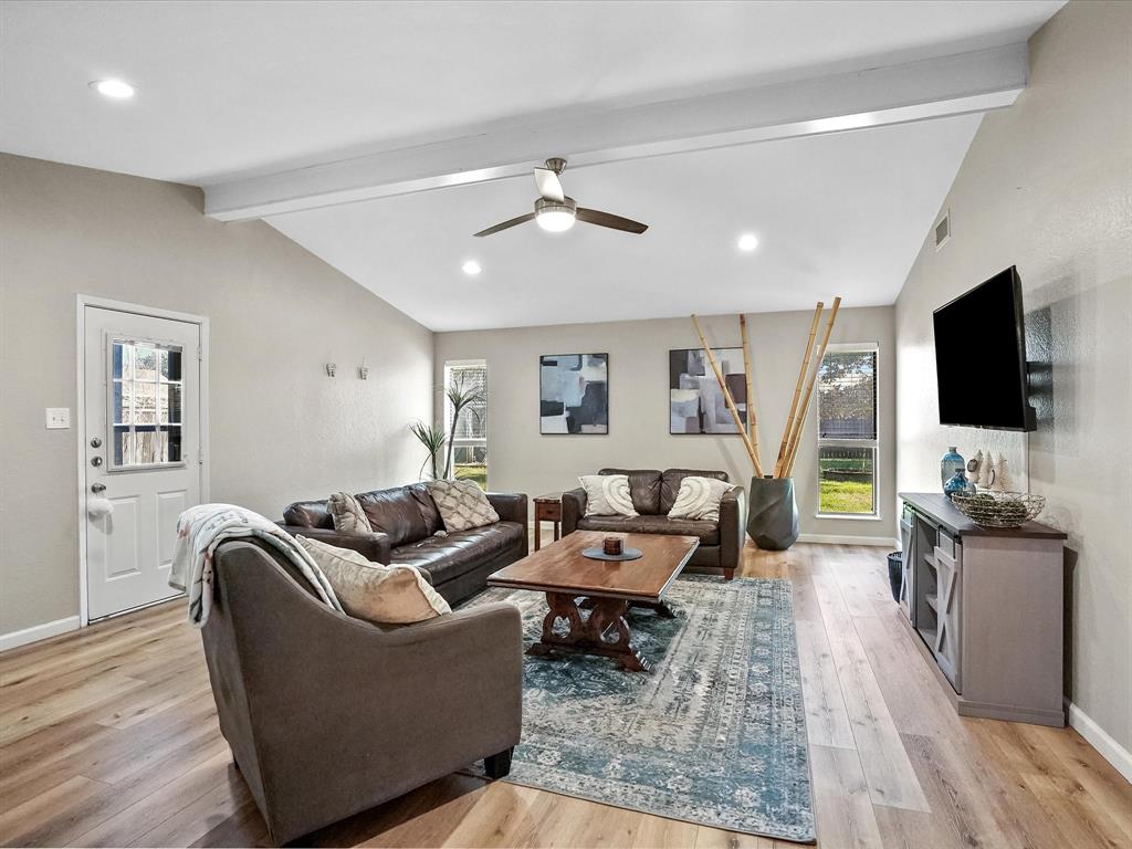 516 South Alabama Street Celina, TX 75009 - Photo 11 of 31 a living room with furniture and a flat screen tv